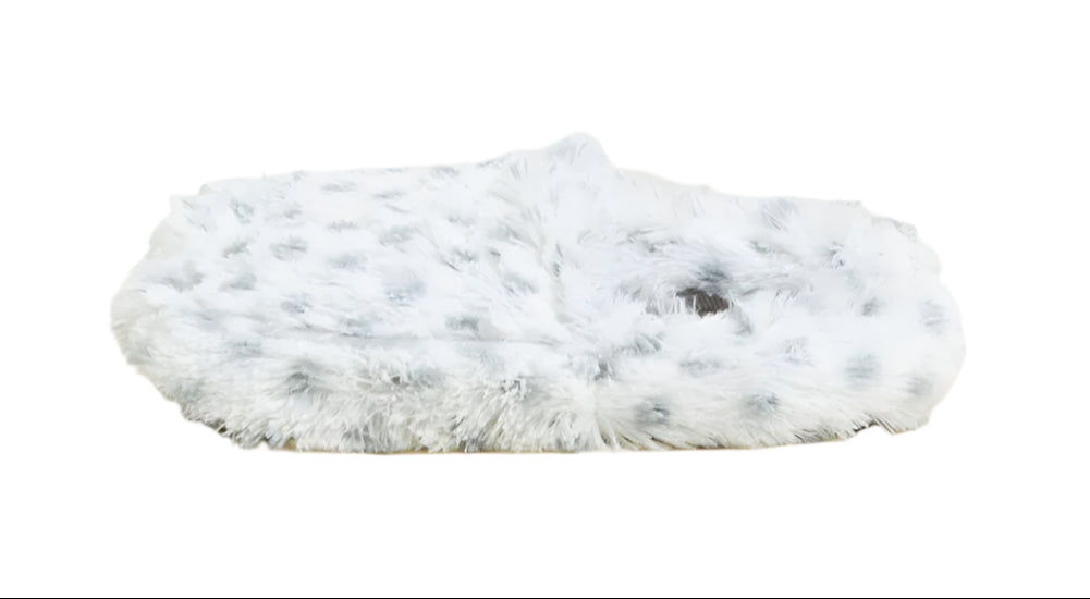 Single white fuzzy slipper with light blue dotted pattern, low profile