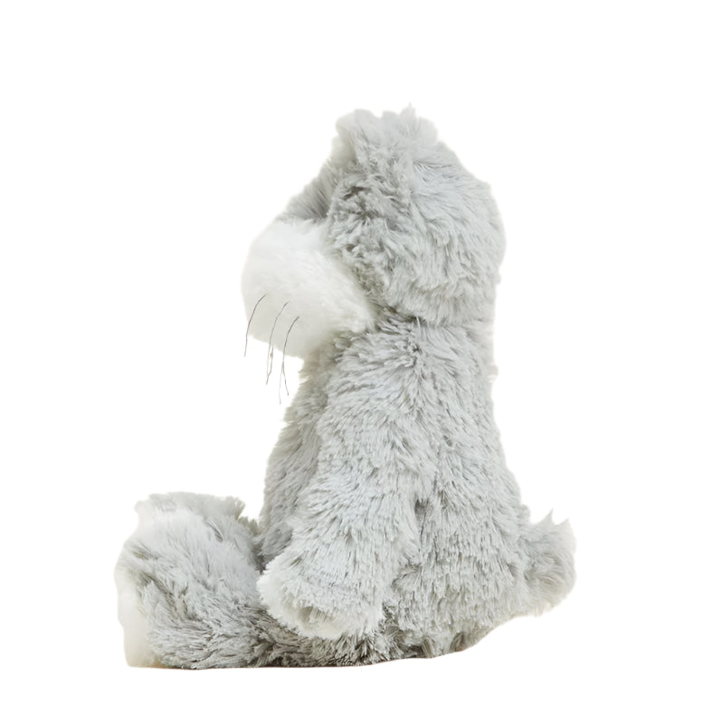 Gray and white plush cat sitting pose, side view with small paws