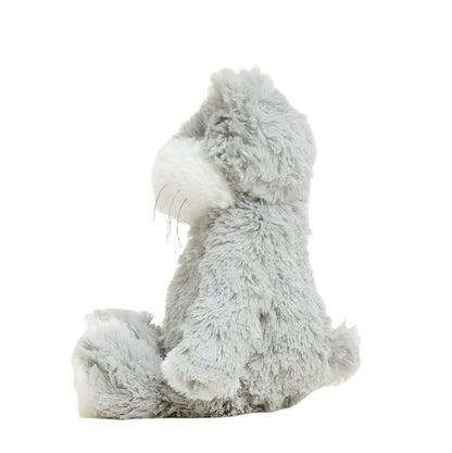 Gray and white plush cat sitting pose, side view with small paws
