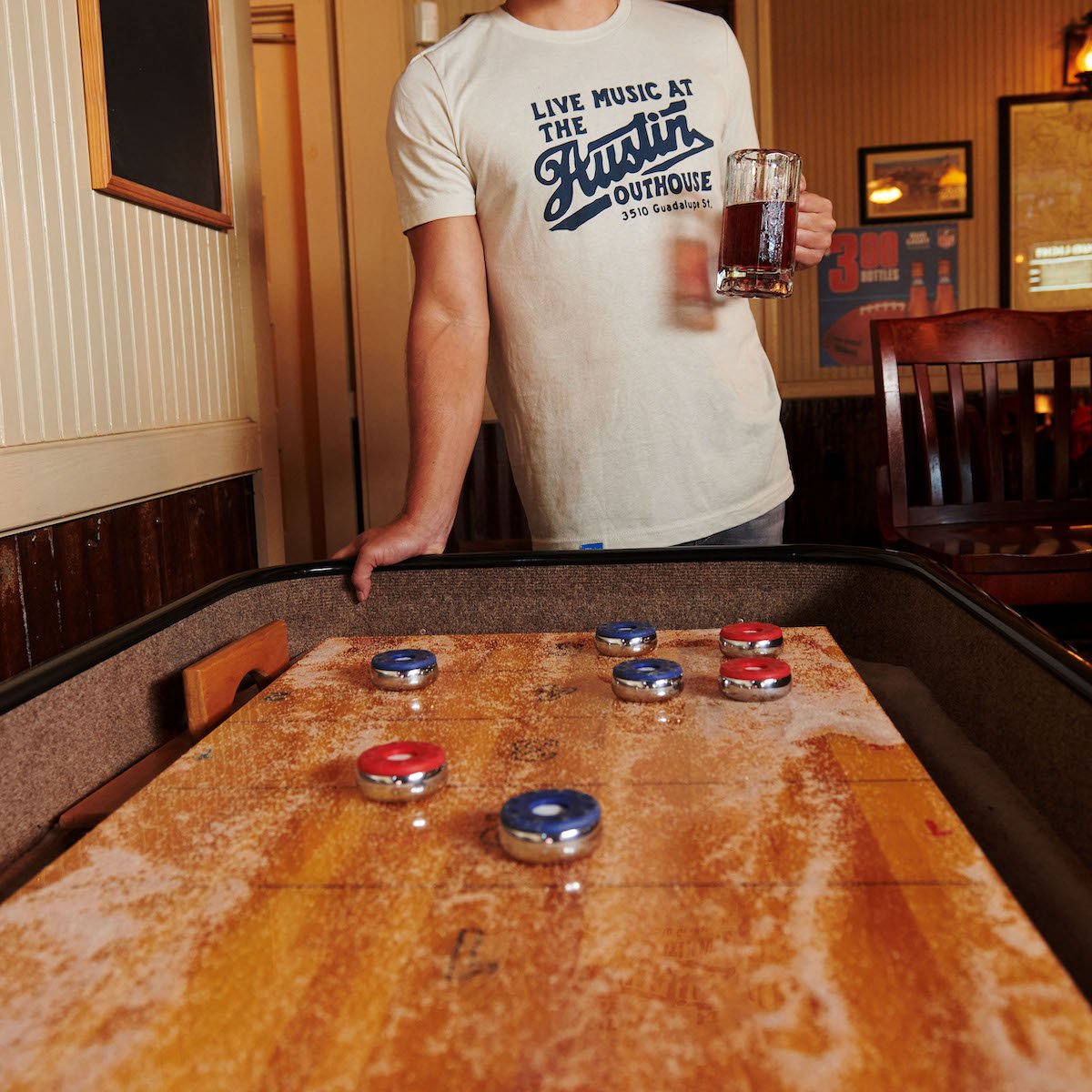 Light gray t-shirt with blue 'Live Music at the' front print, worn by model.