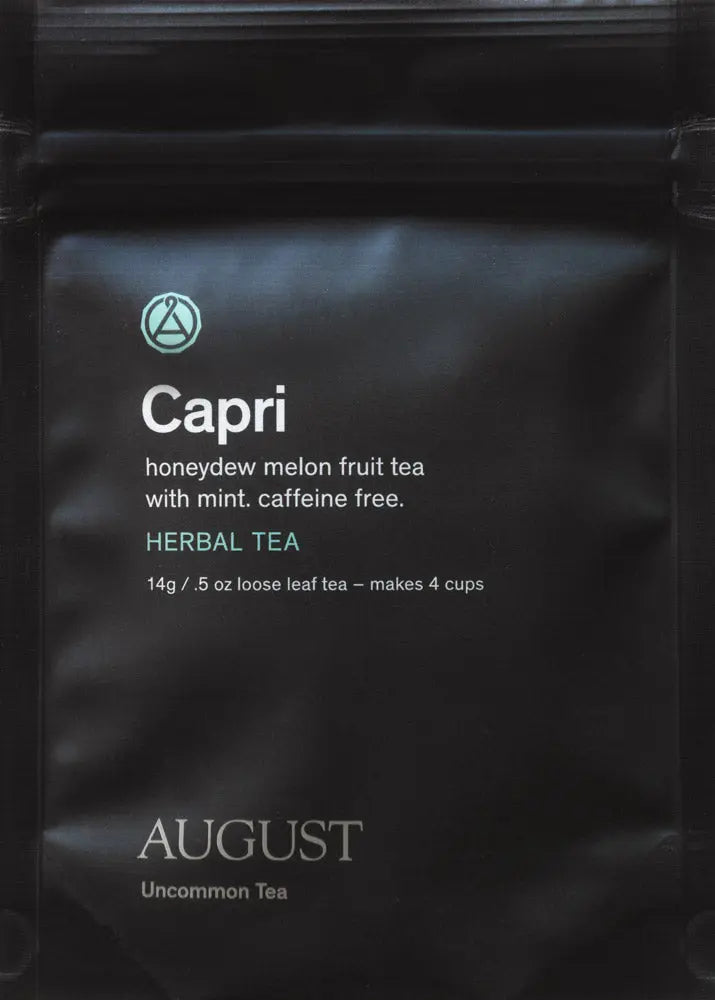 Black Capri herbal tea pouch with mint, caffeine-free, by August.