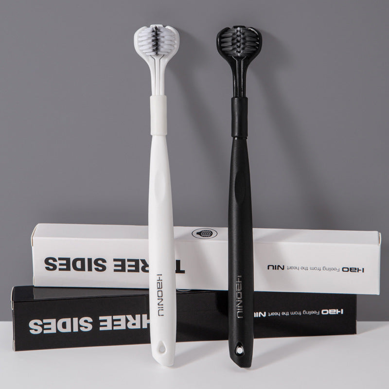 Triple-sided soft bristle toothbrush pair, white and black, shown with boxed inserts