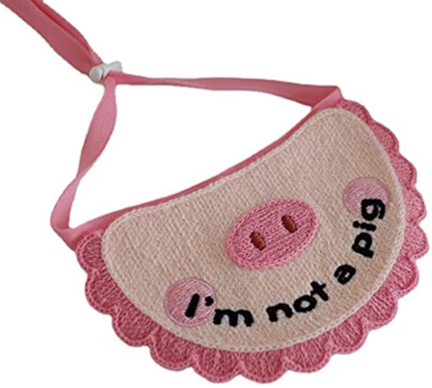 Pink crocheted pet saliva towel with pig face and 'i'm not a pig' text patch