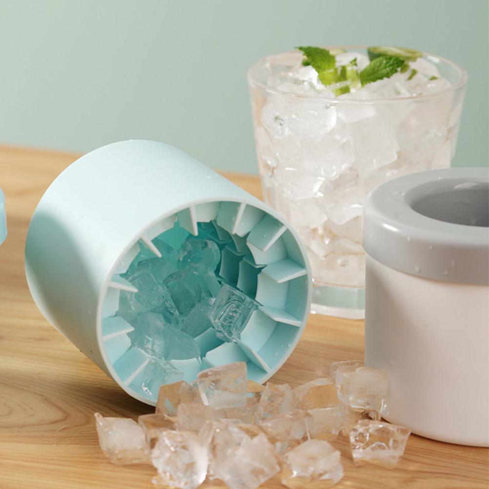 Light blue silicone cylinder ice maker bucket with ice cubes inside open tray