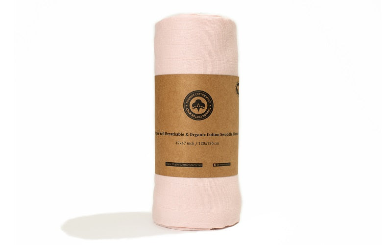 Pink baby girl swaddle blanket, rolled with kraft label