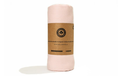Pink baby girl swaddle blanket, rolled with kraft label