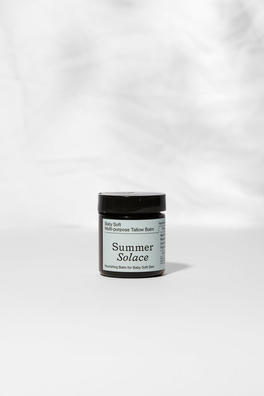 Family balm jar with dark cap and amber container, labeled front view