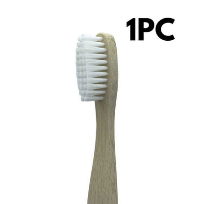 Single bamboo toothbrush with light wood handle and white bristle head