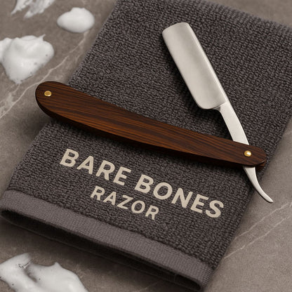 Wood-handled razor with silver blade guard and exposed blade.