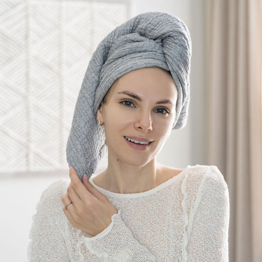 Gray towel wrapped on head, soft textured fabric