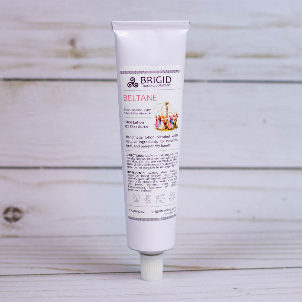 Hand lotion tube with flip-top cap, white tube labeled BRIGID BELTANE