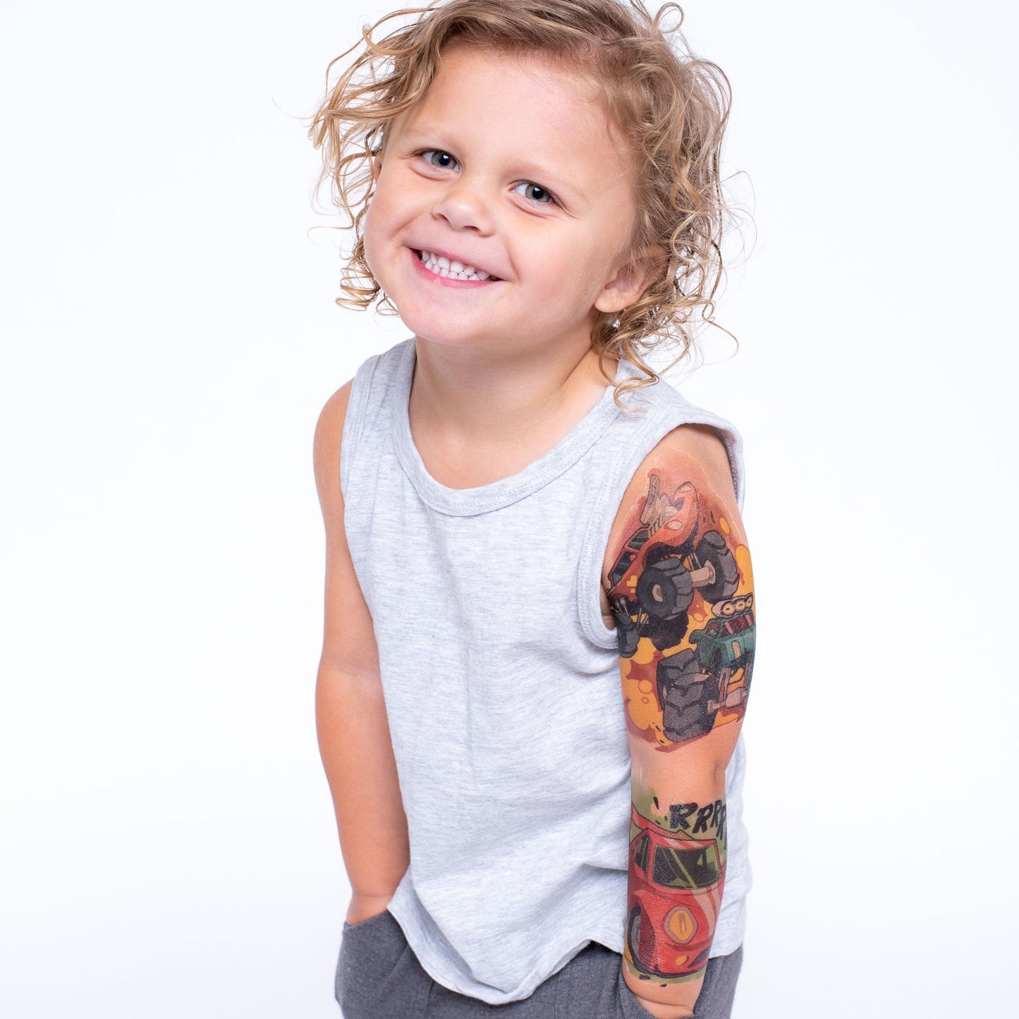 Temporary kids tattoo sleeve on arm, showing multi-color big-wheel scene