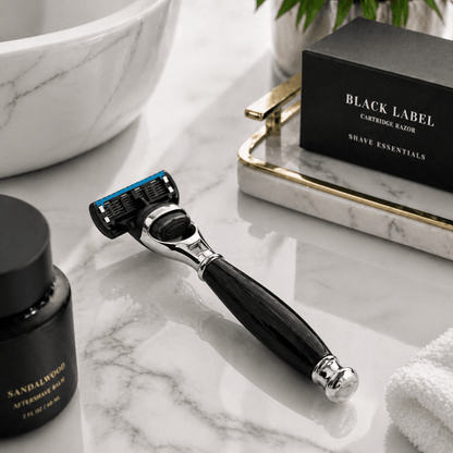 5-blade razor with Black Label cartridges, on bathroom sink counter