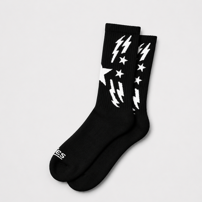 Black boot socks with white lightning and star graphics, ribbed crew cuffs.