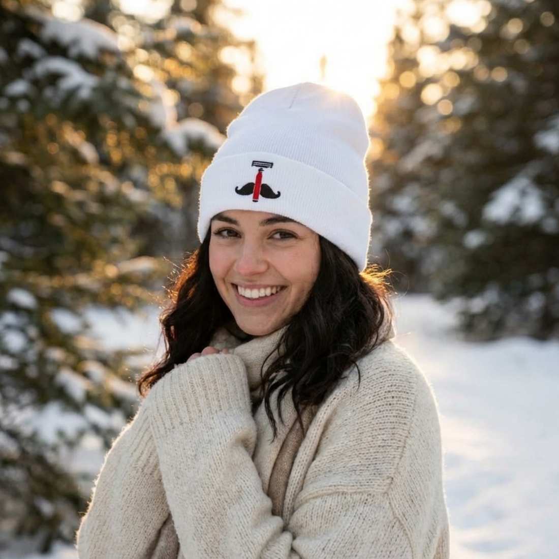 White knit beanie with black anchor emblem and red accent on front.