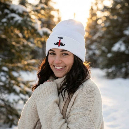 White knit beanie with black anchor emblem and red accent on front.