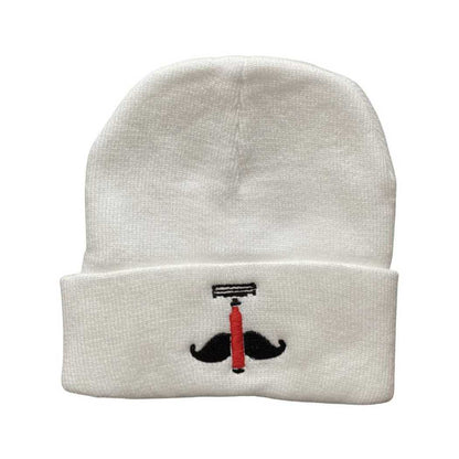 Light cream knit beanie with black anchor emblem featuring a red center on front.