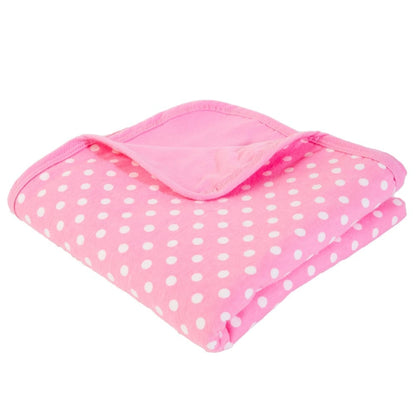Baby blanket in pink with white polka dots, folded with padded edge