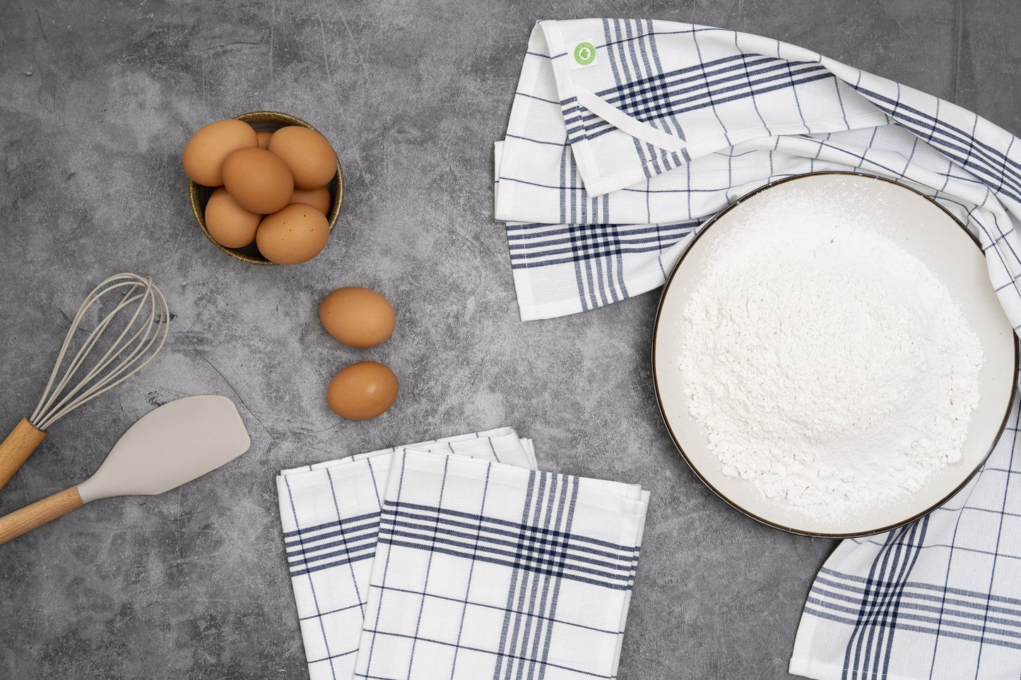 Kitchen towels with blue windowpane grid pattern, folded and stacked