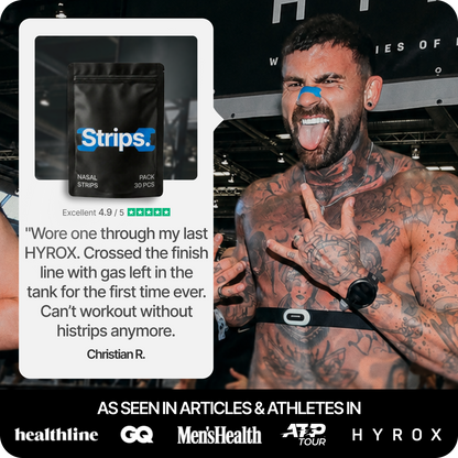 Black nasal strips pouch and blue nasal strip on a smiling man’s face