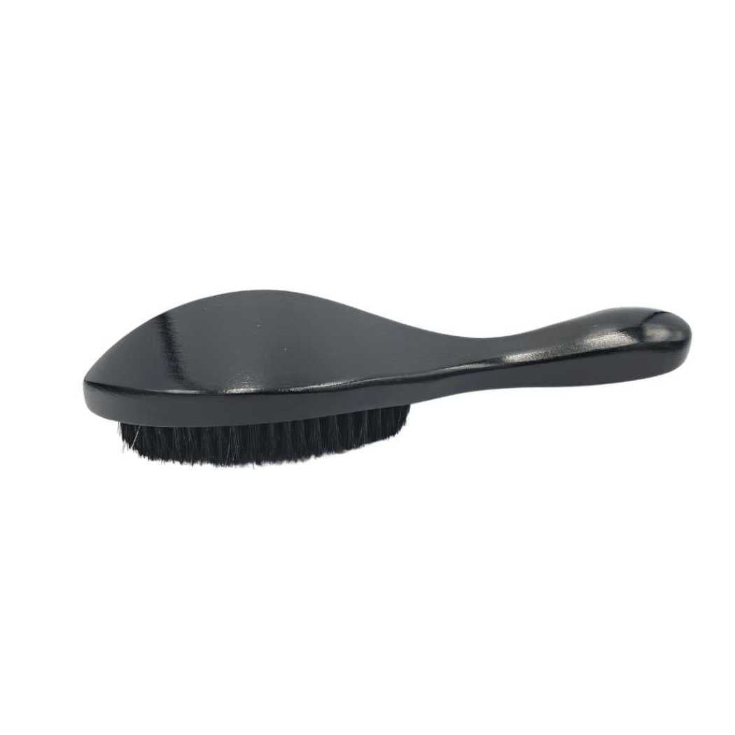 Black boar bristle hair brush with angled handle and dense bristles