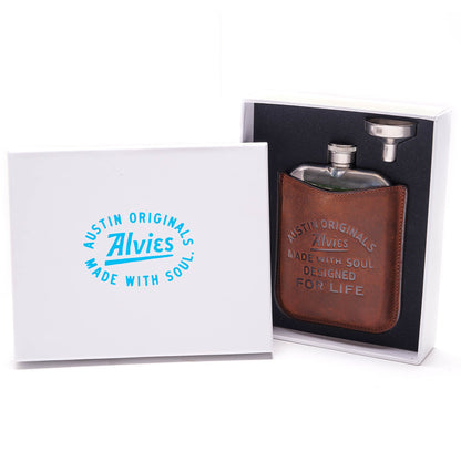 Brown boot flask with engraved front inside a white gift box.