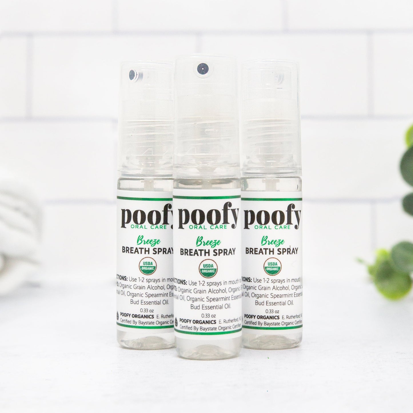 3-pack breath spray bottles with clear pump tops, green-and-white Poofofy labels