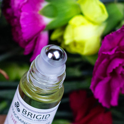 Fragrance roller applicator with BRIGID label and roller ball top