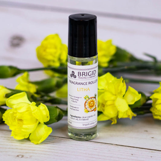 Litha fragrance roller in clear bottle with black cap, labeled Lemon & Orange
