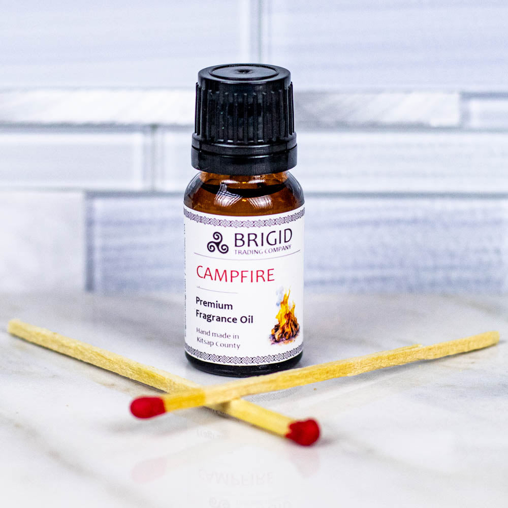 BRIGID premium fragrance oil bottle labeled CAMPFIRE