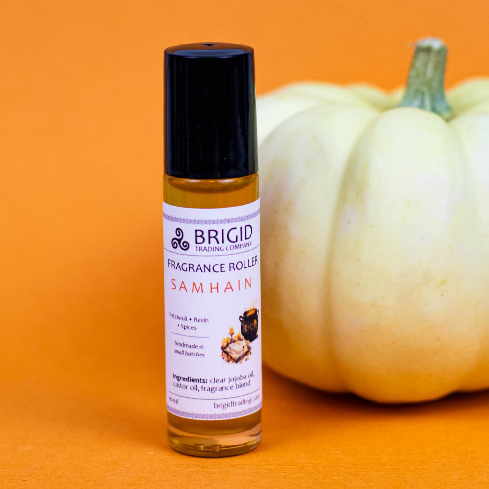 Samhain fragrance roller bottle with purple label, black cap, amber oil