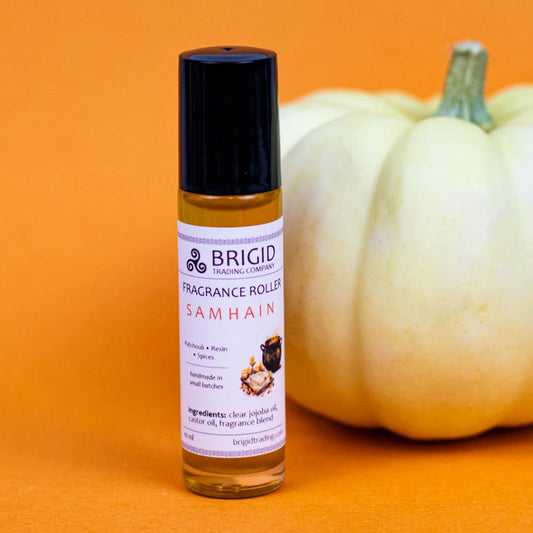 Samhain fragrance roller bottle with purple label, black cap, amber oil