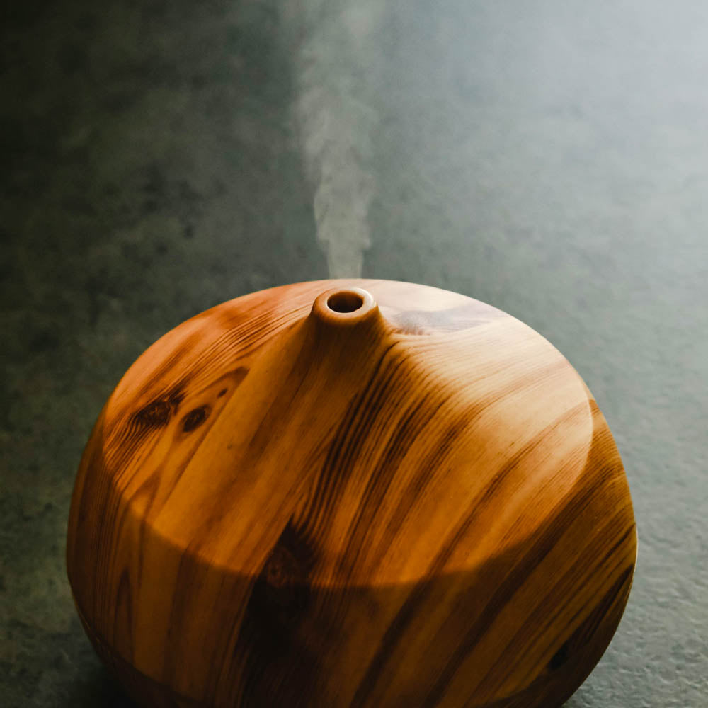 Wooden diffuser bulb with round opening at the top