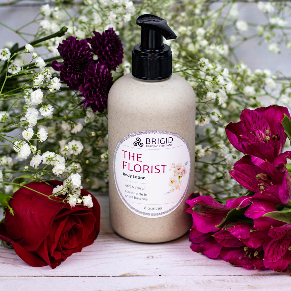 Natural body lotion bottle with black pump and off-white speckled container