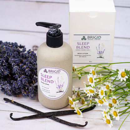Body lotion bottle with black pump, BRIGID Sleep Blend label beside flowers