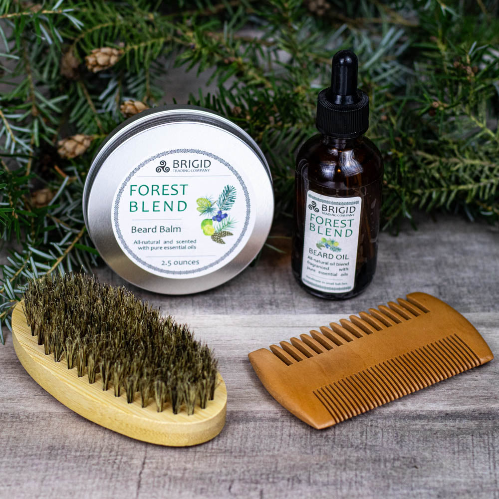 Beard balm tin, beard oil dropper bottle, and wooden brush with comb