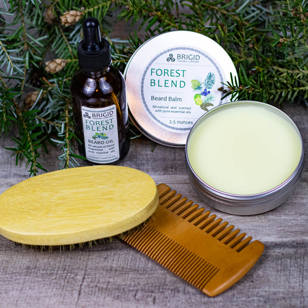 Beard balm tin with pale balm, wooden lid, comb, and beard oil bottle
