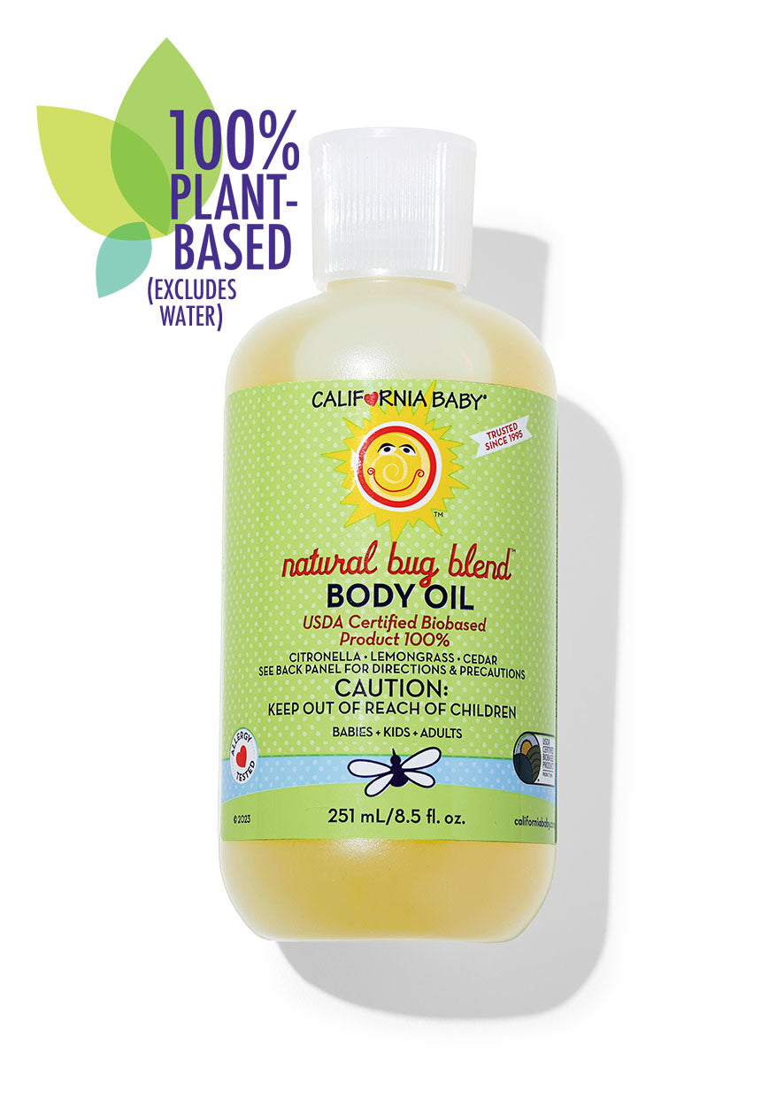 Bug Blend body oil bottle with clear pump, green label, pale yellow liquid
