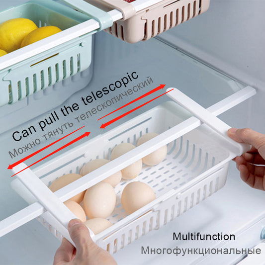 Blue plastic kitchen shelf organizer basket with handles and perforated sides, holding eggs