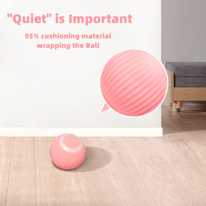 Pink cushioned automatic cat ball toy on floor with smooth power button top