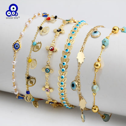 Gold-tone charm bracelets with evil-eye and heart charms, multicolor beads