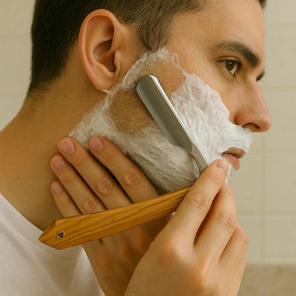 Camelback Edge straight razor in use with white shaving lather