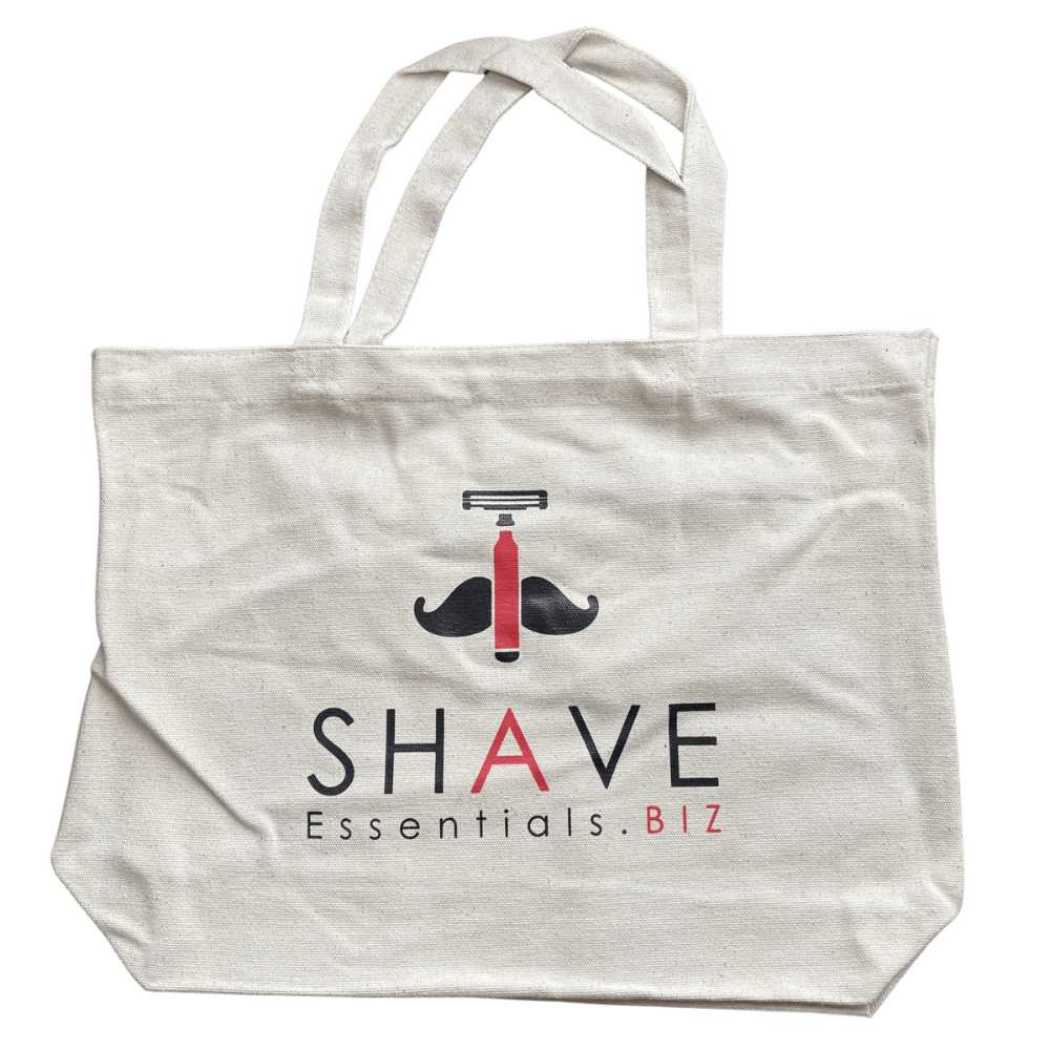 Light canvas tote bag with front graphic and handles, 'SHAVE' text
