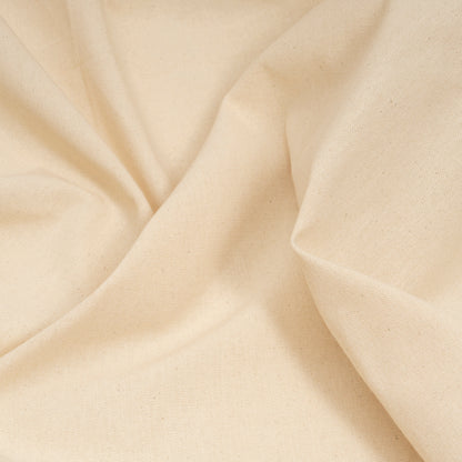 Cotton canvas fabric close-up with smooth weave in light beige
