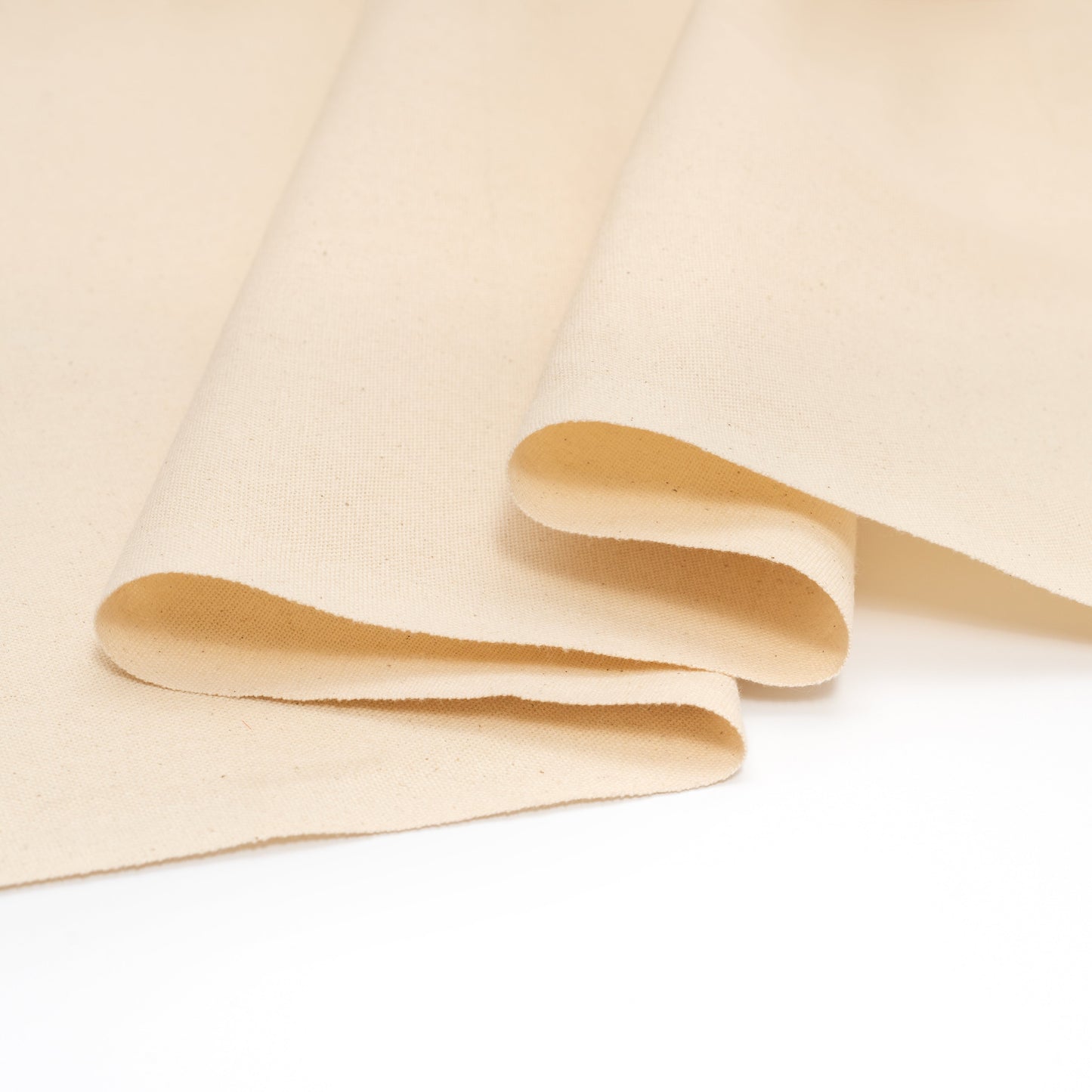 Cotton canvas fabric folded sheets with layered edges, light beige