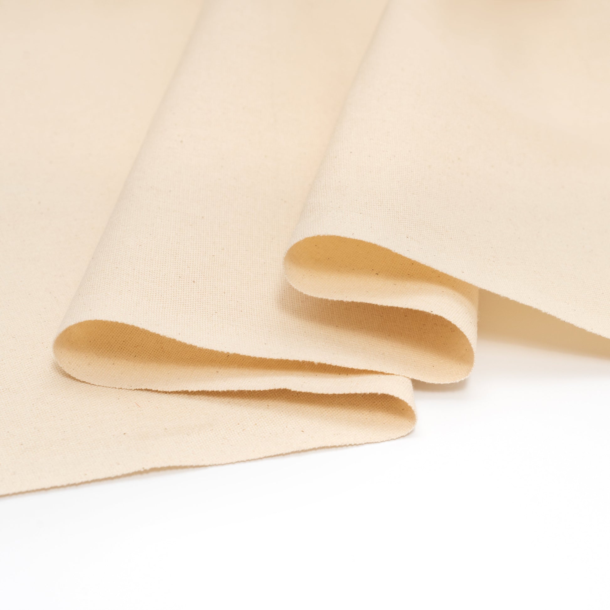 Cotton canvas fabric folded sheets with layered edges, light beige
