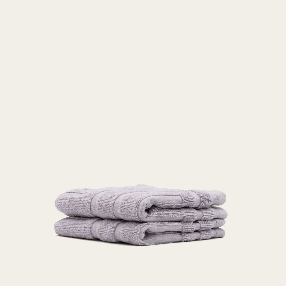 Lilac cotton towels, folded hand towel stack with terry texture