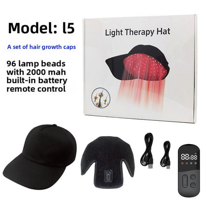 Black cap-style light therapy hair growth device with remote control and cords