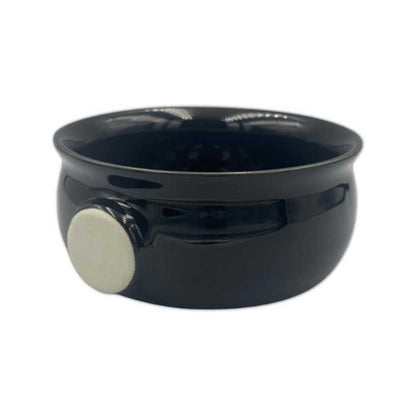 Black ceramic lather bowl with a side handle and glossy finish