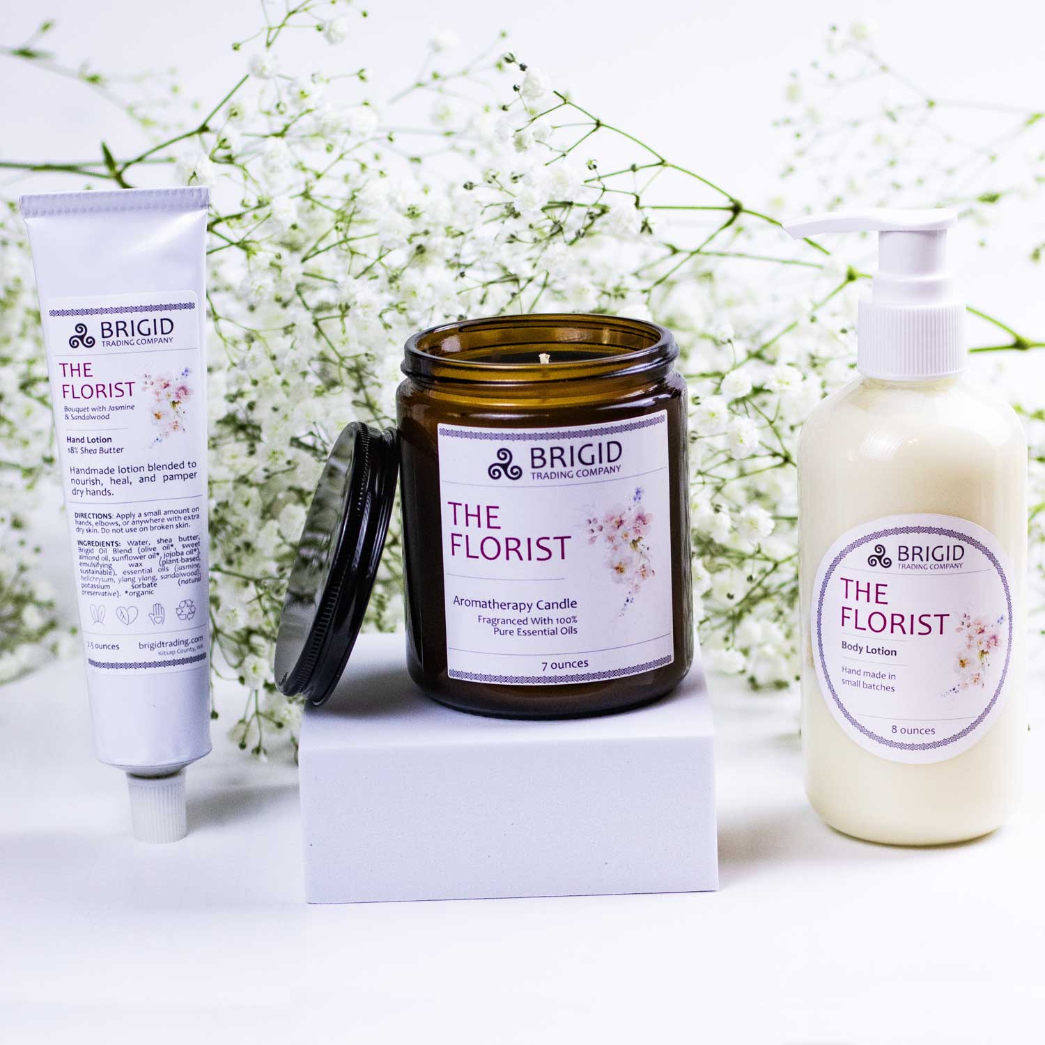 BRIGID The Florist candle and lotion bottles on white blocks